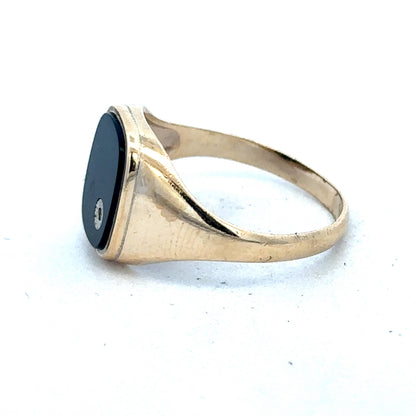 9ct yellow gold signet ring with a smooth polished surface, size T, by Reeves and Sons.