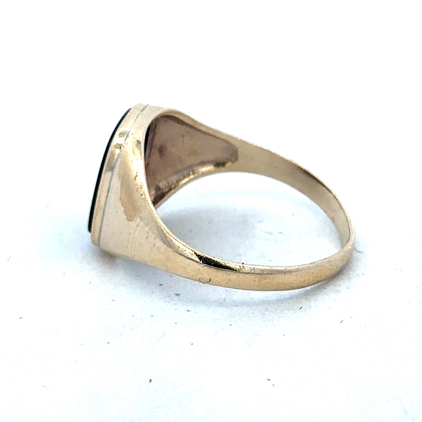 9ct yellow gold signet ring in size T with engraved face, crafted by Reeves and Sons, displayed on a neutral background.