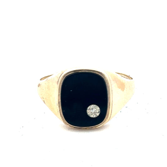 9ct yellow gold signet ring in size T with Reeves and Sons branding, featuring a polished smooth surface and classic design.