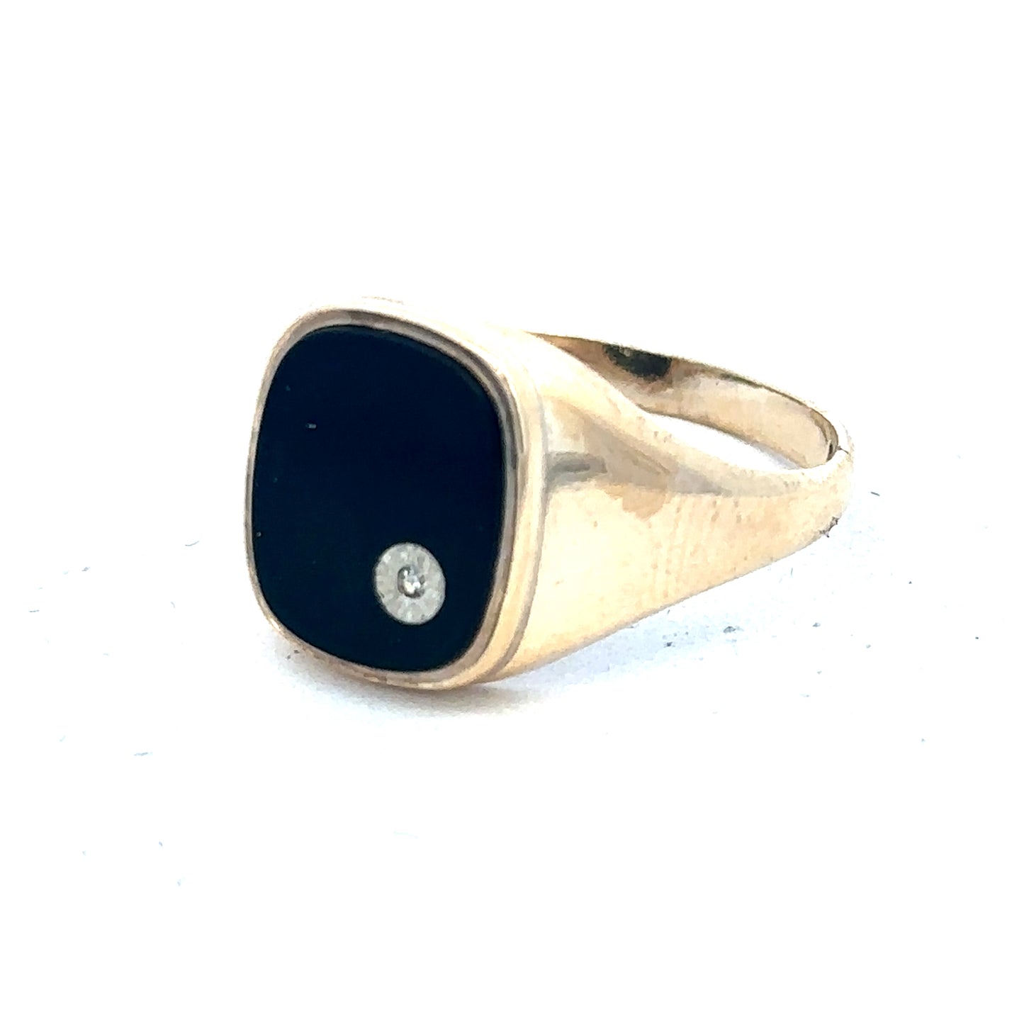 9ct yellow gold signet ring in size T with Reeves and Sons branding, featuring a smooth polished surface.