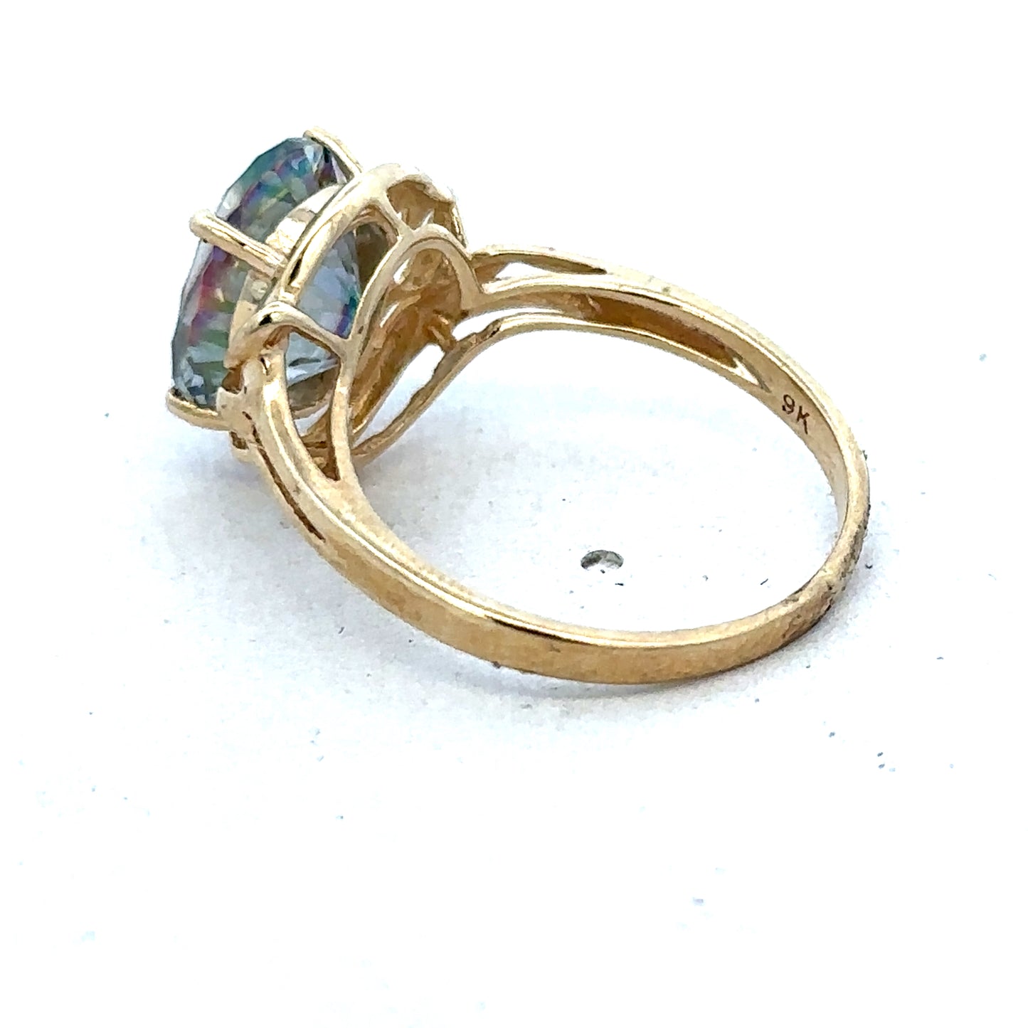 9ct yellow gold ring in size P with a smooth band, crafted by Reeves and Sons.