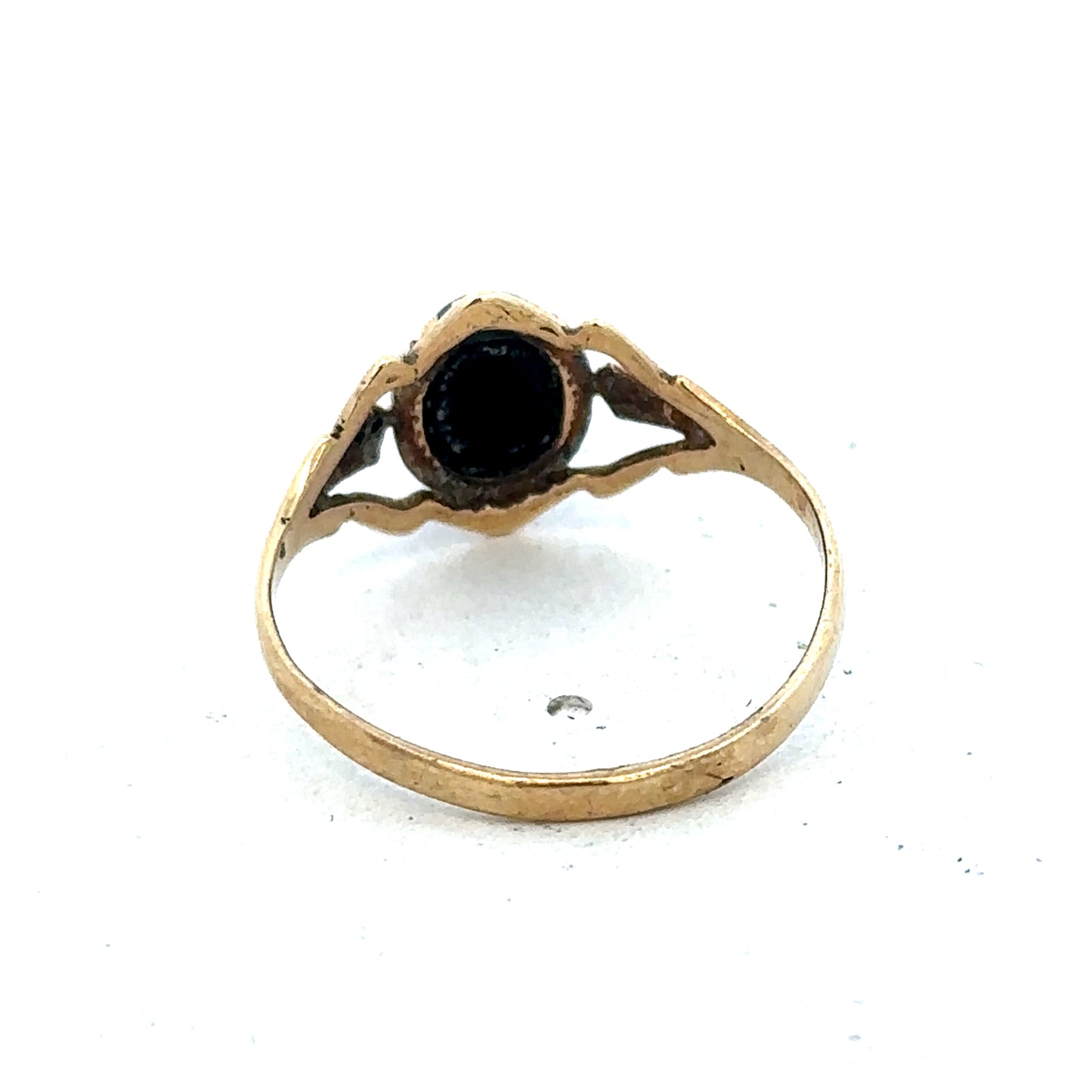 9ct yellow gold ring in size P1/2 with a smooth band, crafted by Reeves and Sons, shown in close-up detail.