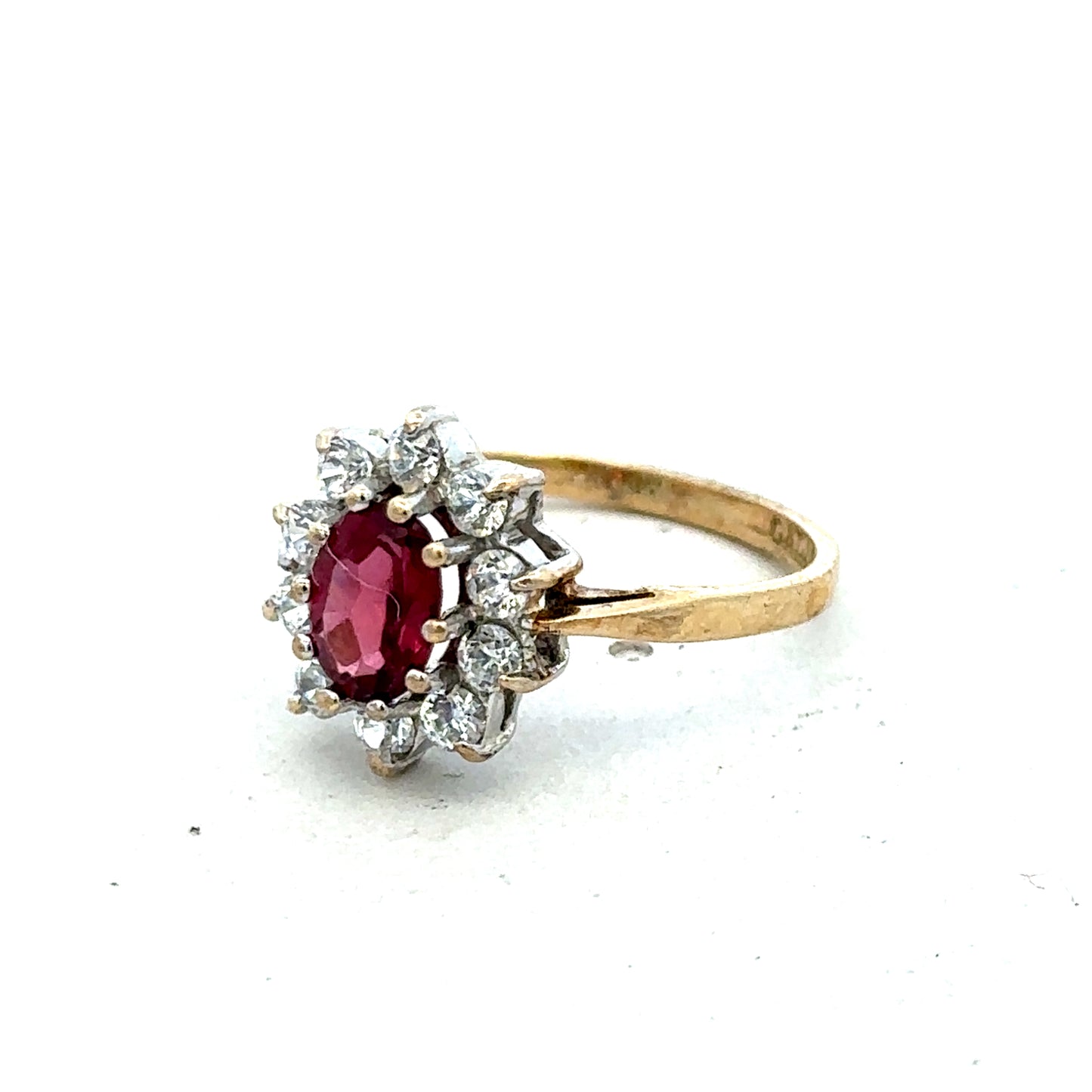9ct yellow gold ring in size N with a smooth band, crafted by Reeves and Sons, shown close-up on a white background.