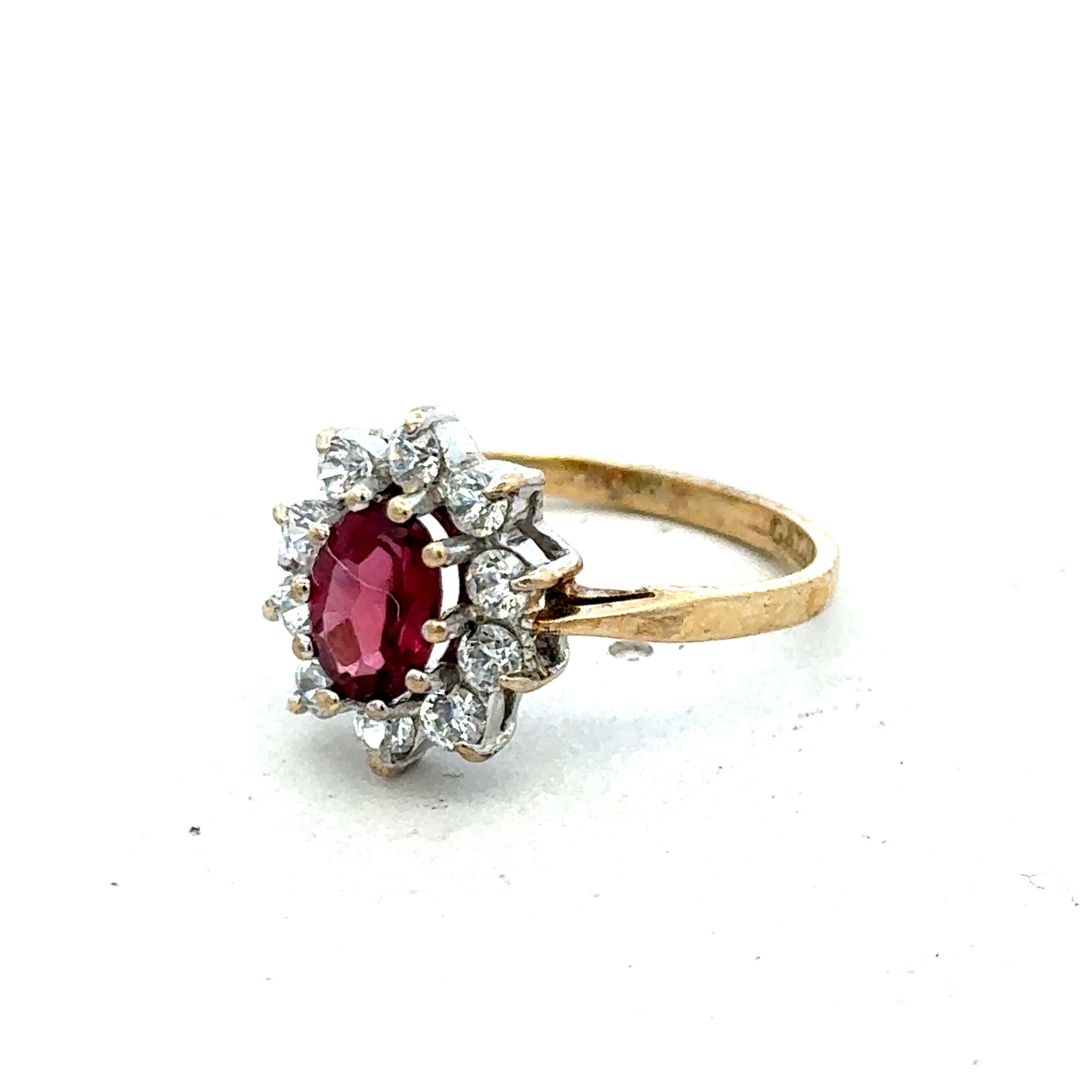 9ct yellow gold ring in size N with a smooth band, crafted by Reeves and Sons, shown close-up on a white background.