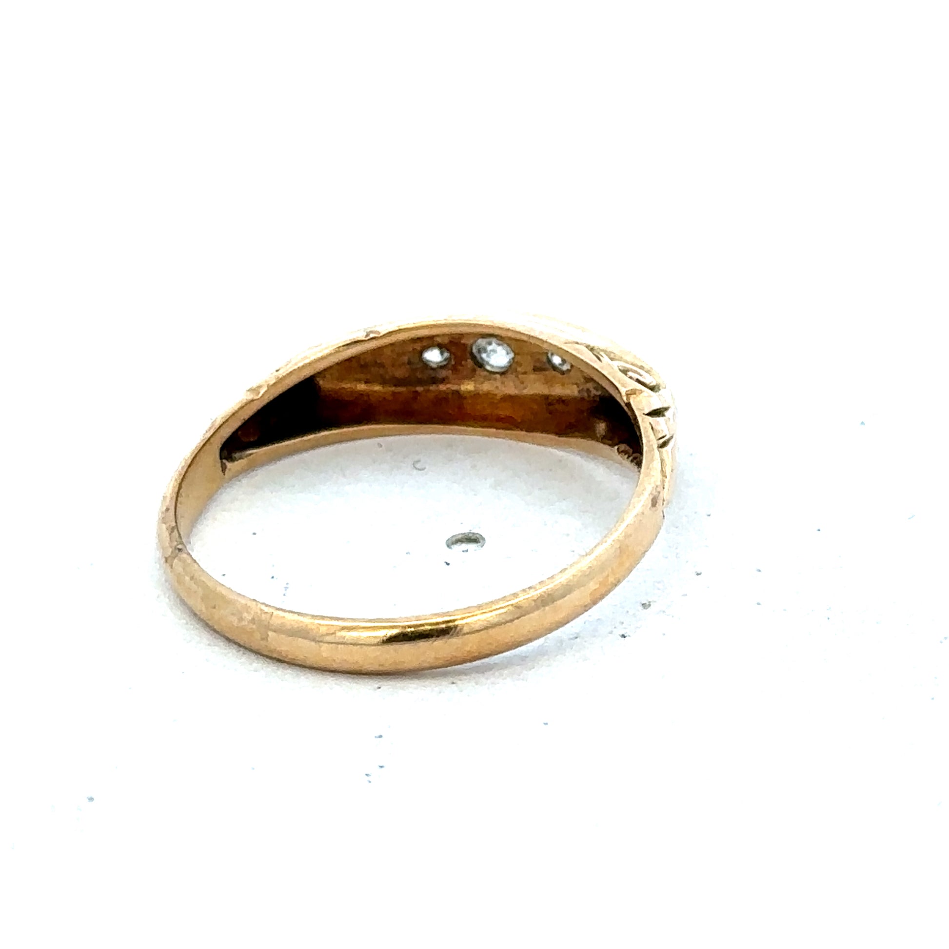 18ct yellow gold diamond ring by Reeves and Sons, size P, with sparkling diamonds and intricate band details.