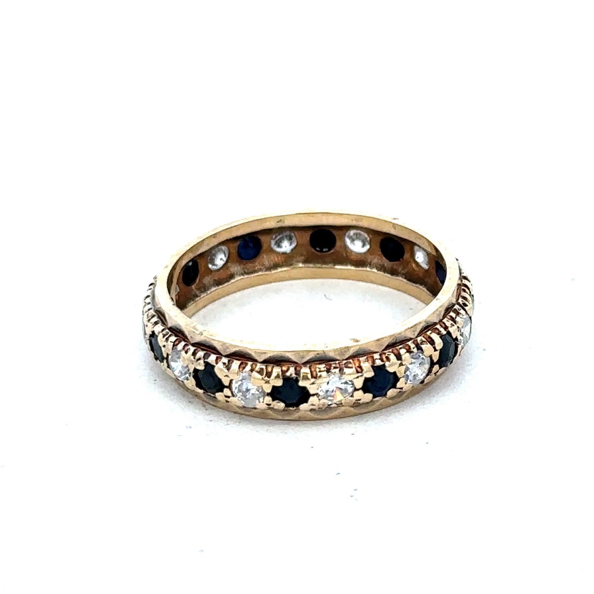 9ct yellow gold ring in size M1/2 featuring a smooth band, crafted by Reeves and Sons, shown in close-up detail.