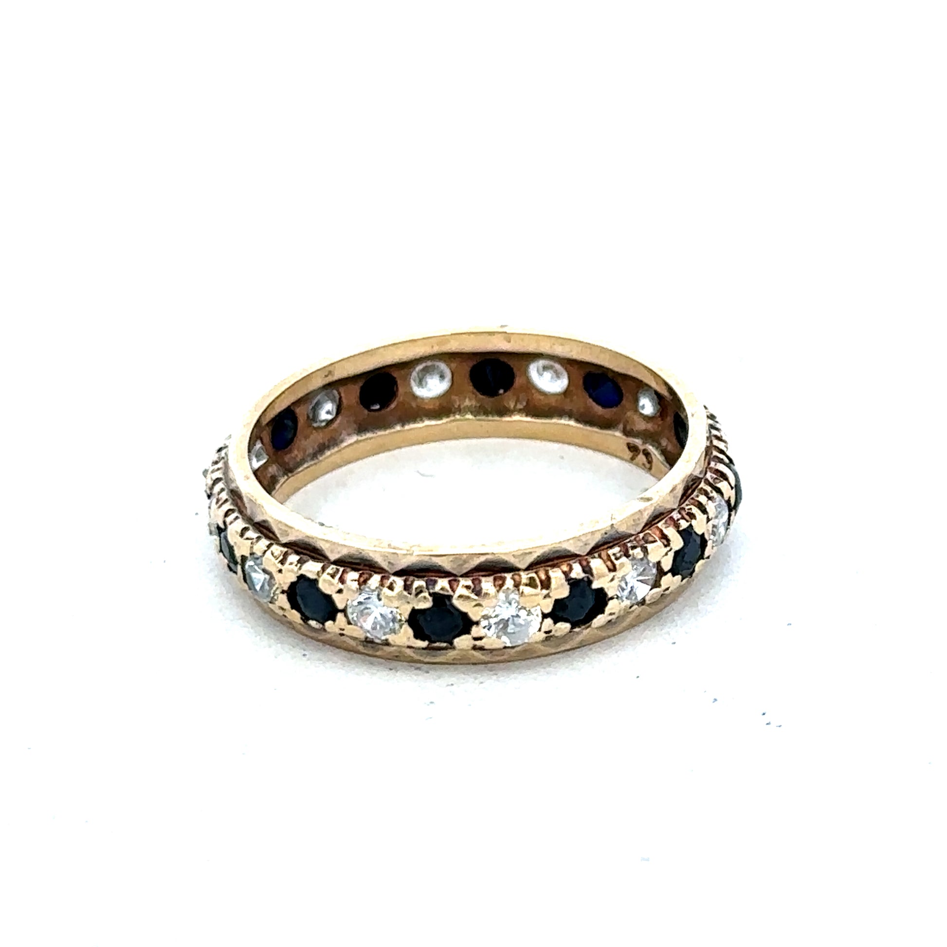 9ct yellow gold ring size M1/2 by Reeves and Sons, close-up showing polished band and detailed craftsmanship.