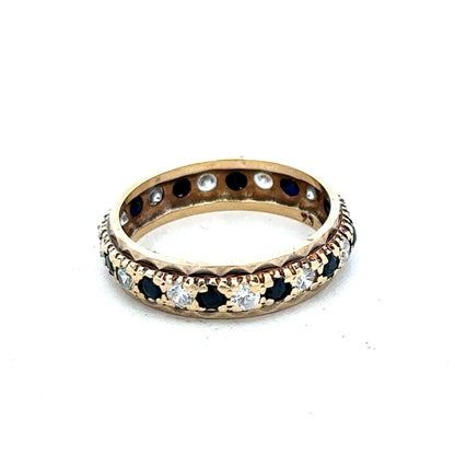 9ct yellow gold ring size M1/2 by Reeves and Sons, close-up showing polished band and detailed craftsmanship.
