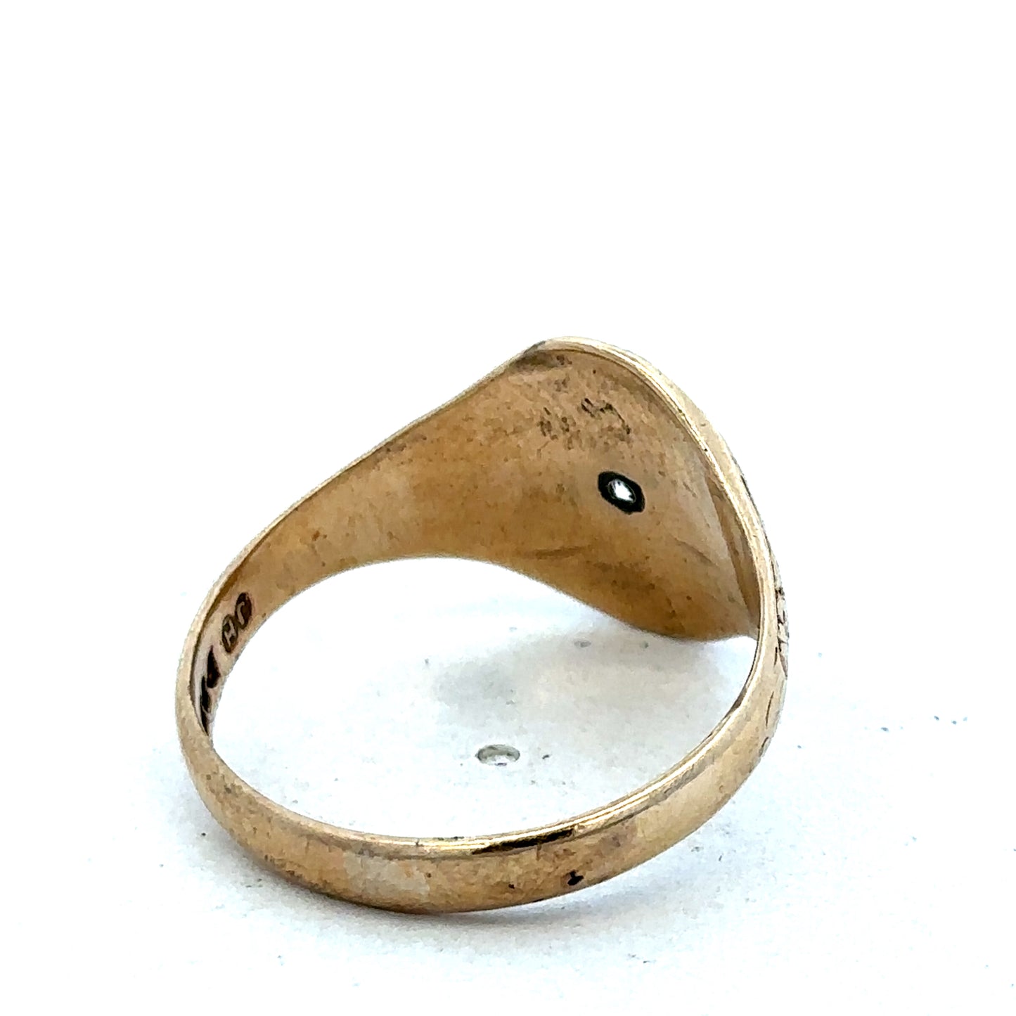 9ct yellow gold signet ring in size U with Reeves and Sons branding, featuring a smooth polished surface and classic design.
