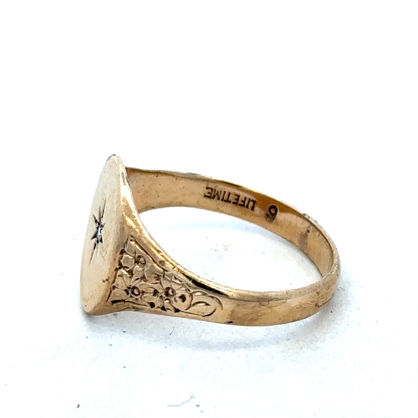 9ct yellow gold signet ring in size U with engraved face, crafted by Reeves and Sons, displayed on a neutral background.