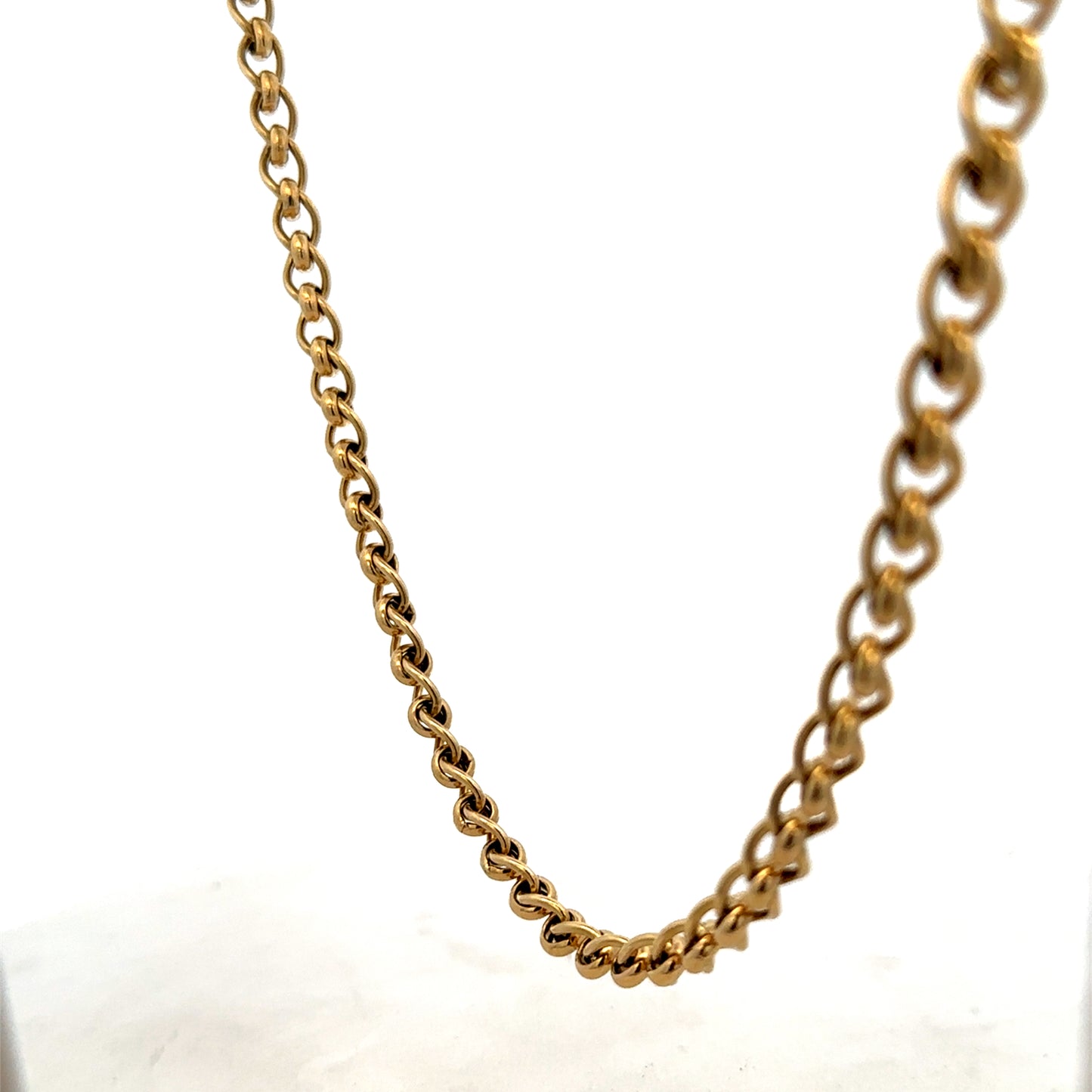 9ct yellow gold rollerball chain weighing 33.9g, featuring a smooth, shiny finish and classic design by Reeves and Sons.
