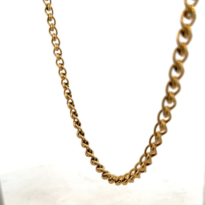 9ct yellow gold rollerball chain weighing 33.9g, featuring a smooth, shiny finish and classic design by Reeves and Sons.