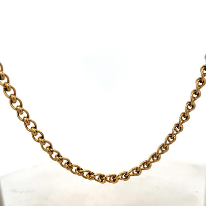 Reeves and Sons 9ct yellow gold rollerball chain, 33.9g, with detailed close-up of the shiny, smooth gold links.