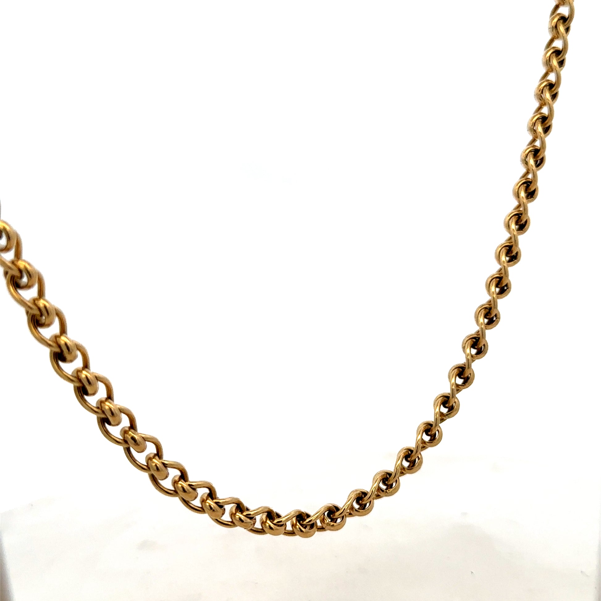 9ct yellow gold rollerball chain, 33.9g from Reeves and Sons, showcasing its polished gold finish and linked design.