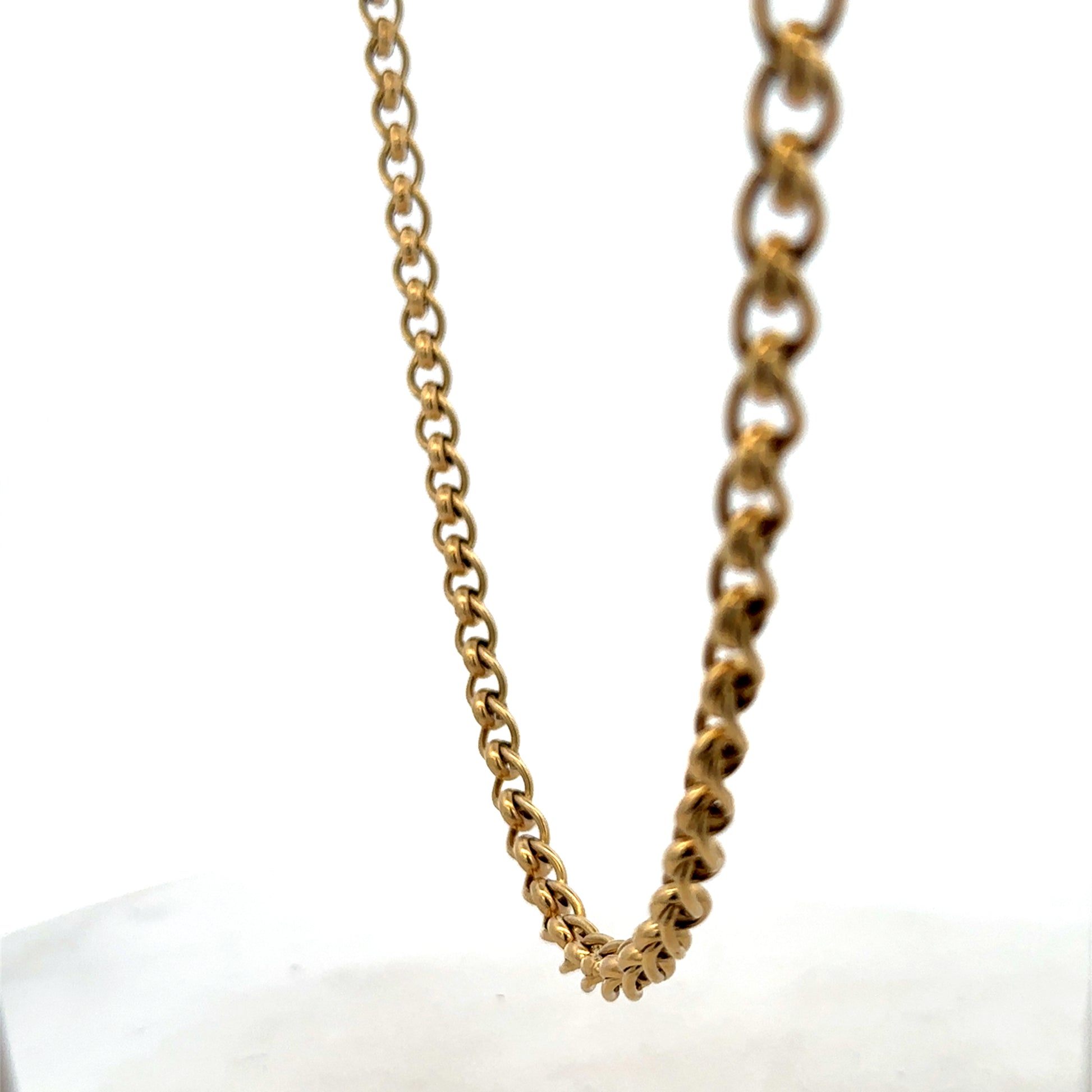 Reeves and Sons 9ct yellow gold rollerball chain, 33.9g, showing close-up of the textured gold chain link details.