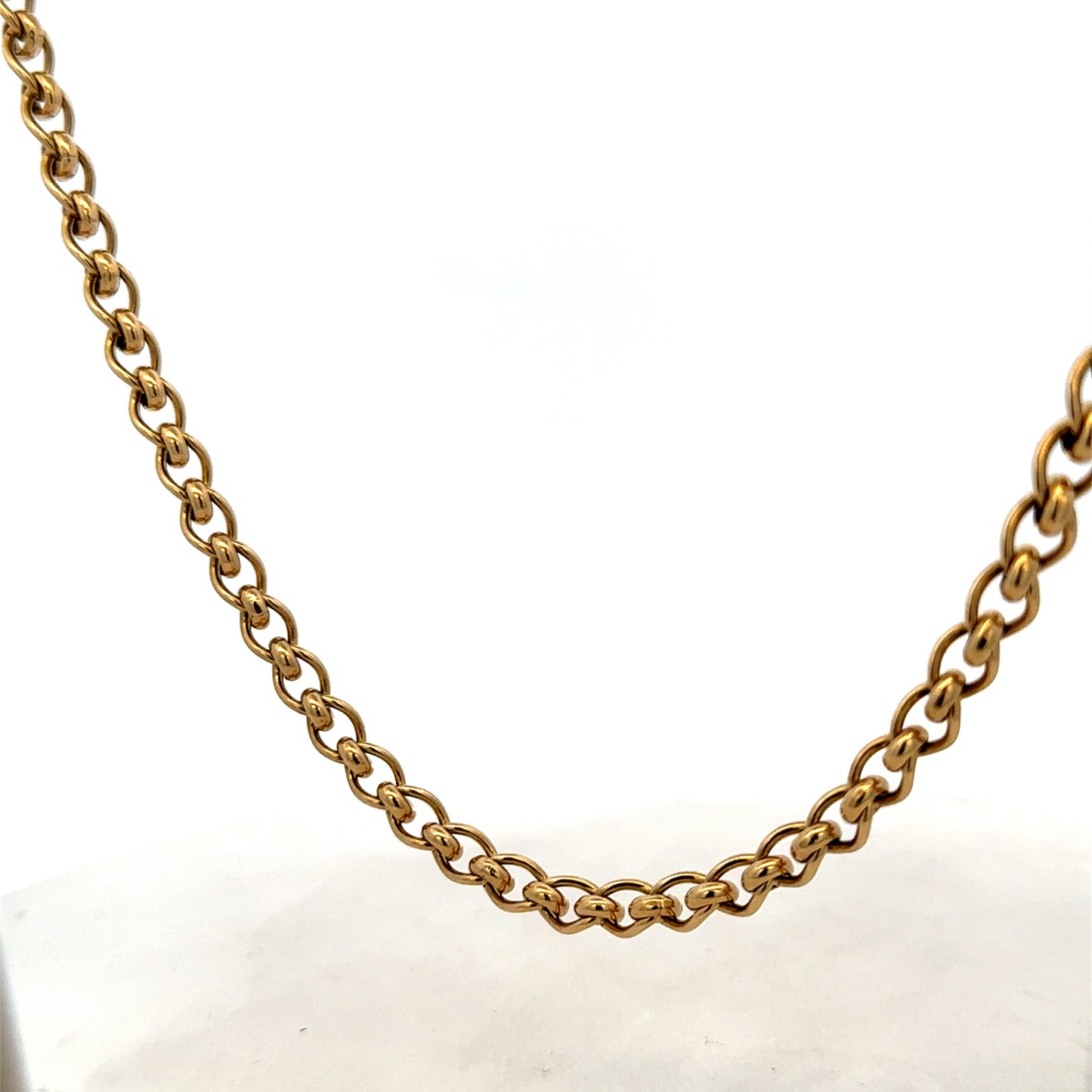 Reeves and Sons 9ct yellow gold rollerball chain, 33.9g, close-up showing detailed gold chain links.