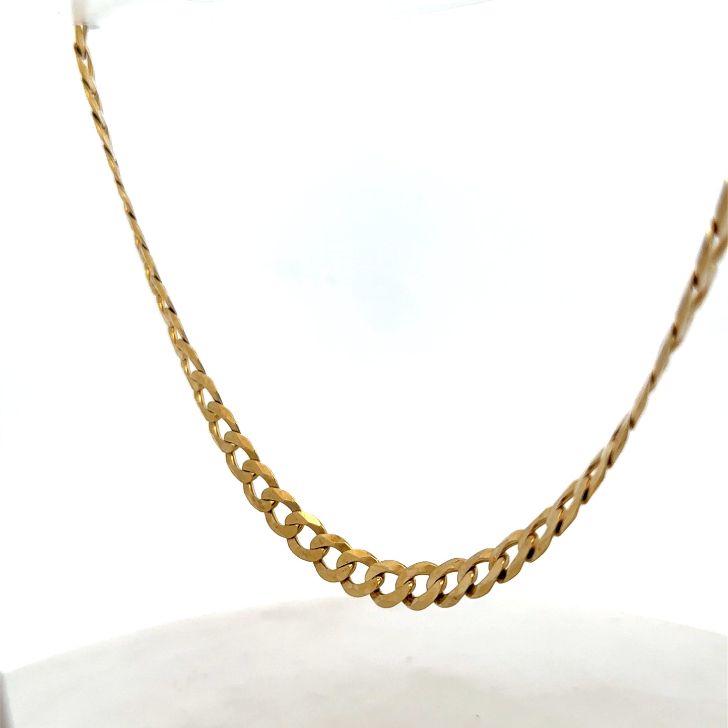 9ct yellow gold curb chain weighing 26.5g, featuring a classic link design, by Reeves and Sons, displayed on a neutral background.