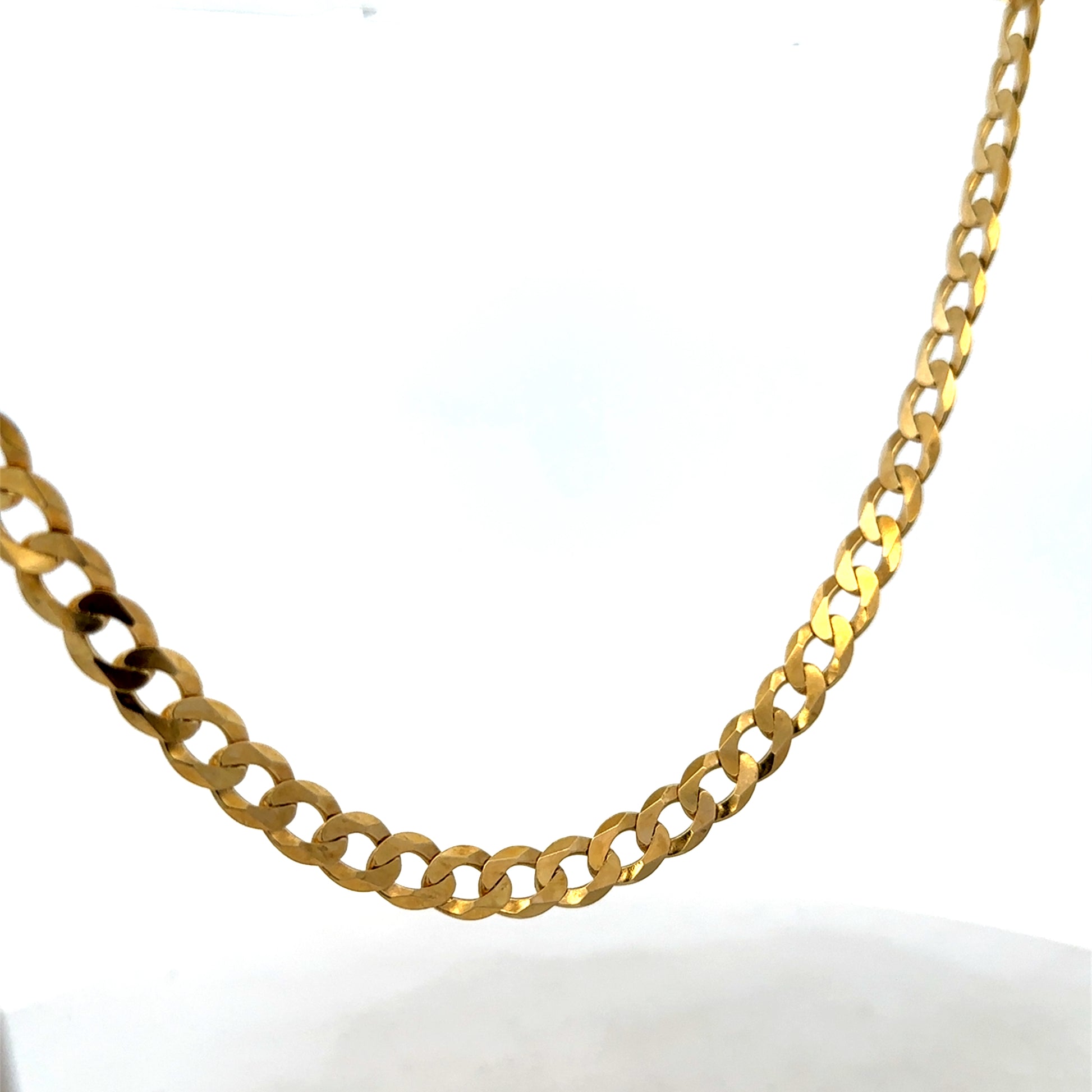 9ct yellow gold curb chain weighing 26.5g, featuring classic links, crafted by Reeves and Sons.