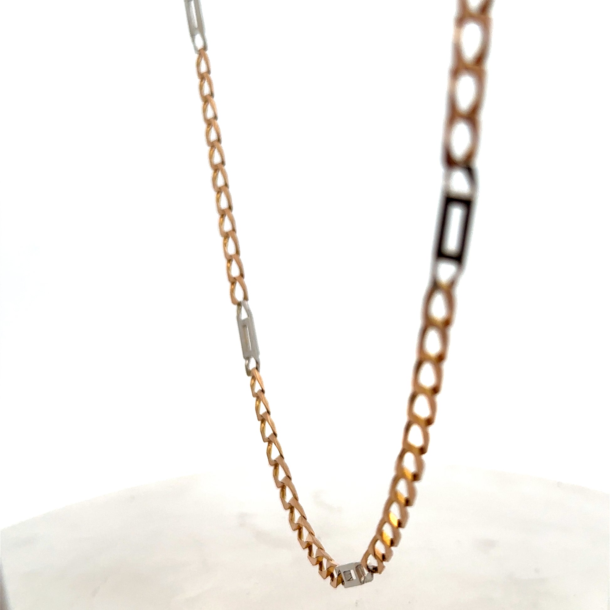 9ct yellow gold chain weighing 13.9g, crafted by Reeves and Sons, shown in a close-up image highlighting its fine design and shine.