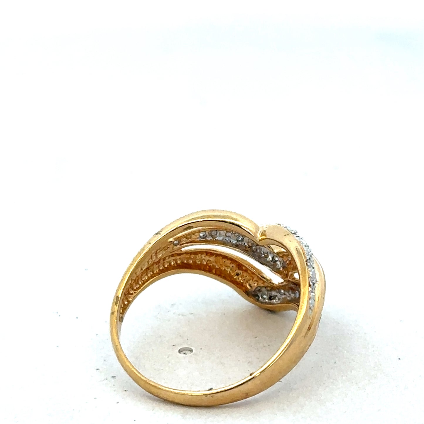 18ct yellow gold diamond ring by Reeves and Sons, featuring a sparkling diamond centerpiece and elegant band design.