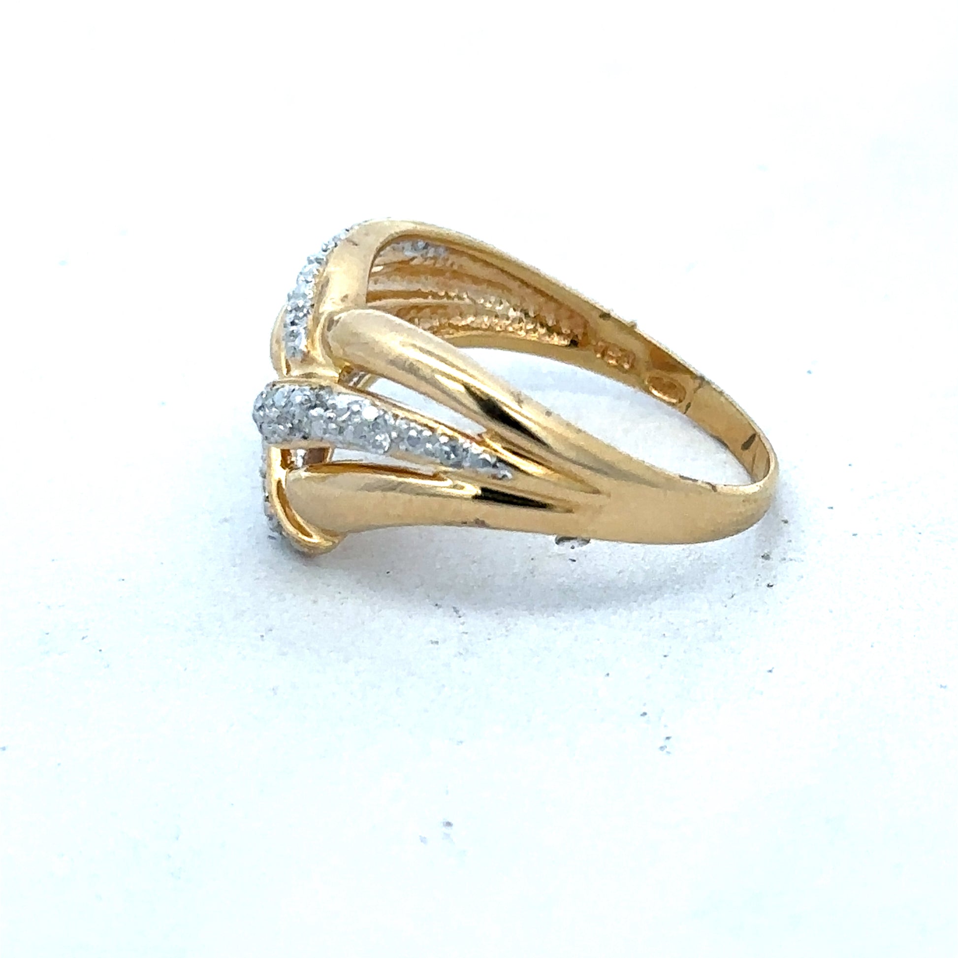 18ct yellow gold diamond ring by Reeves and Sons, featuring a sparkling diamond centerpiece and elegant design.