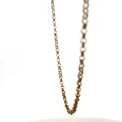 9ct yellow gold belcher chain, Reeves and Sons, 4.7g, close-up of the shiny, linked gold chain on a plain background.