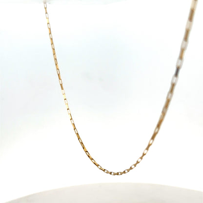 9ct yellow gold chain from Reeves and Sons, showing a delicate, shiny jewelry chain with a fine link design.
