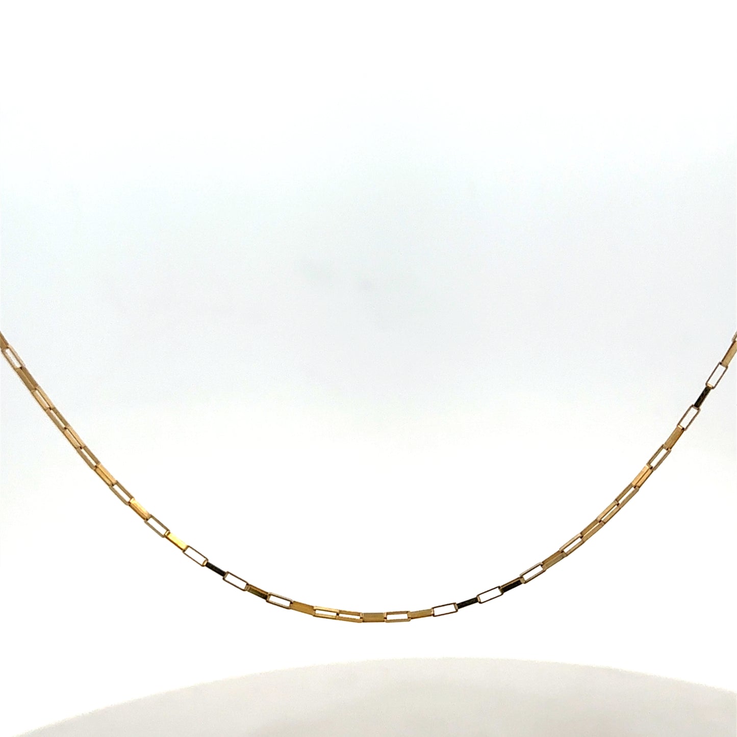 Reeves and Sons 9ct yellow gold chain, 1.8g, showcasing a delicate and polished jewelry chain with intricate links.