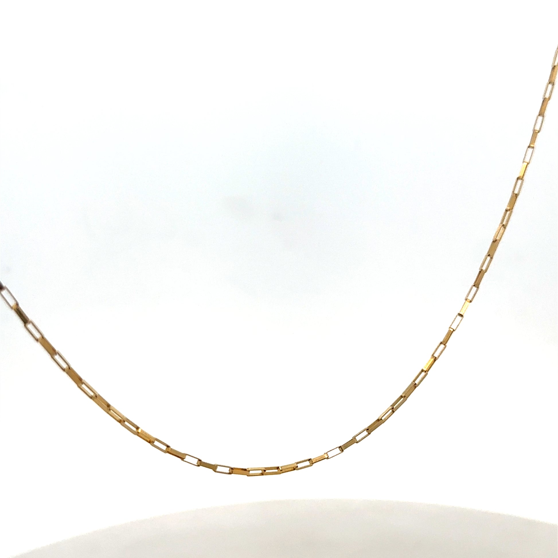 9ct yellow gold chain from Reeves and Sons, weighing 1.8g, with a close-up view showing its fine link design.