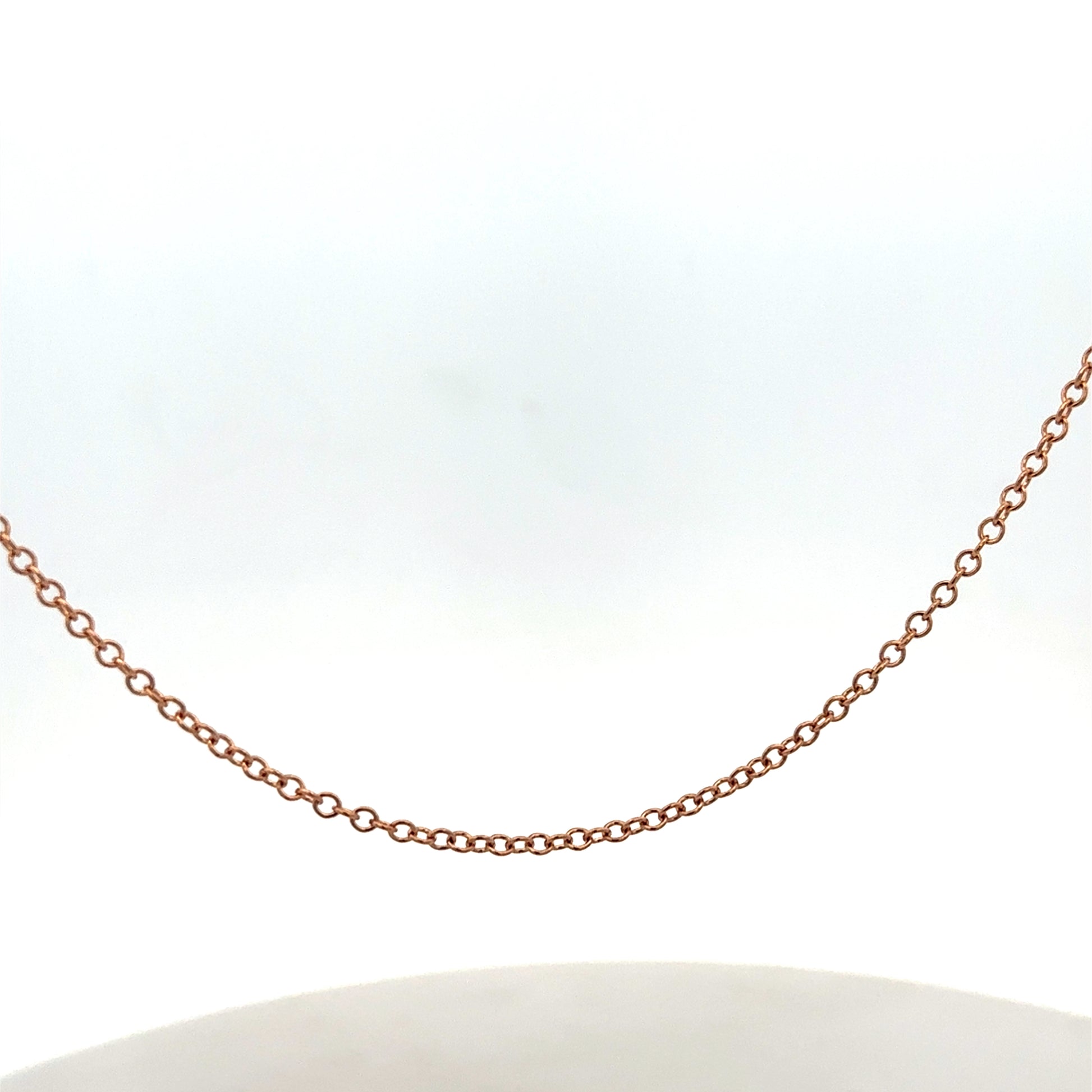 9ct gold chain weighing 4.4g, featuring a delicate link design, from Reeves and Sons.