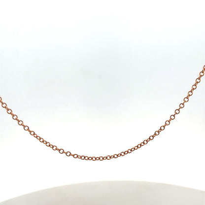 9ct gold chain weighing 4.4g, featuring a delicate link design, from Reeves and Sons.