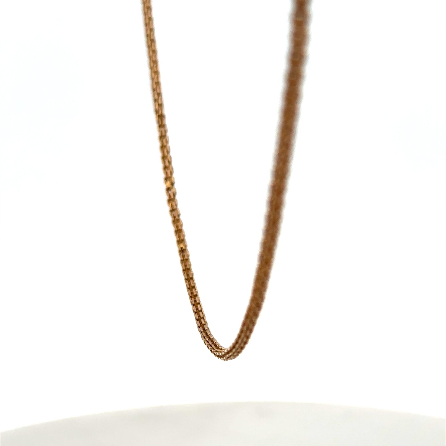 9ct yellow gold chain from Reeves and Sons, shown with a close-up of the smooth, polished link design.