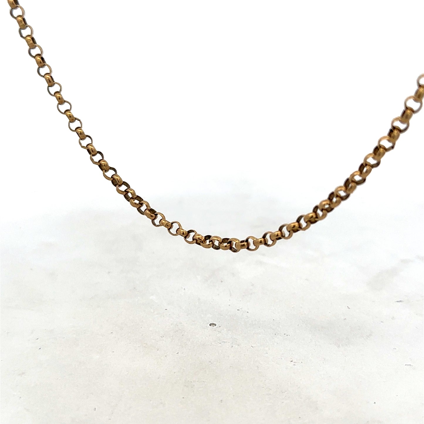 9ct yellow gold belcher chain from Reeves and Sons, showing its textured links and polished finish.