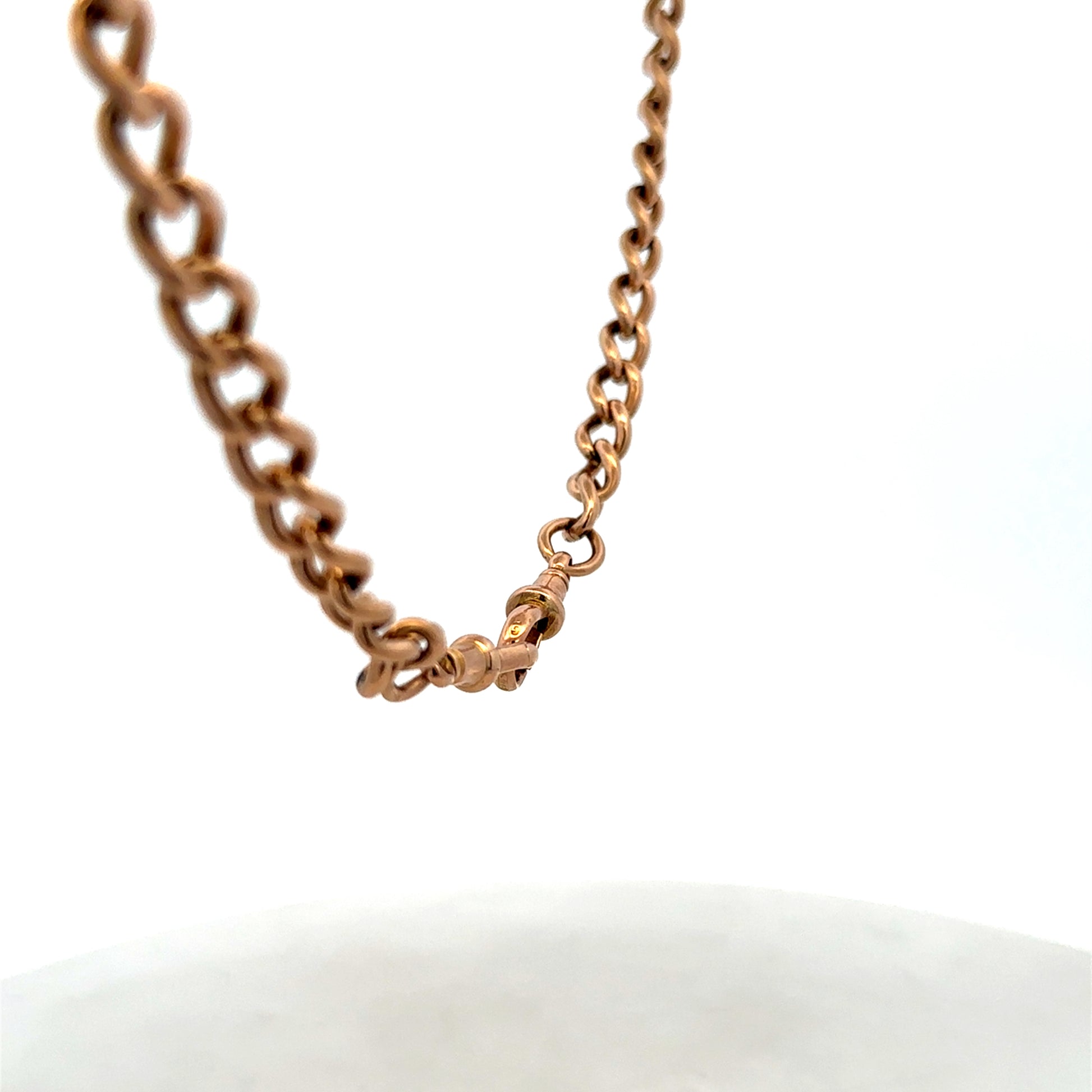 9ct yellow gold bracelet by Reeves and Sons, 31.3g, featuring a polished chain design, shown on a neutral background.