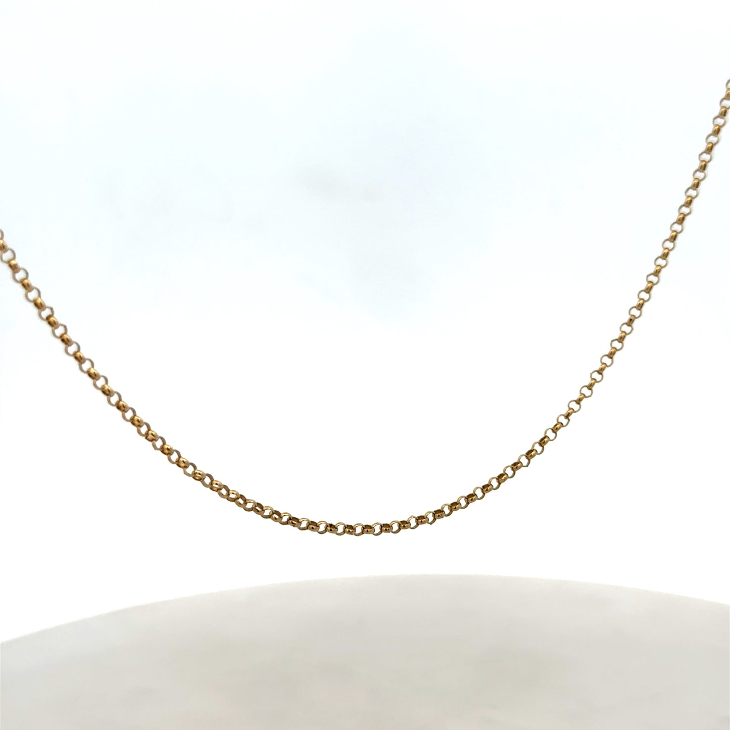 9ct yellow gold belcher chain from Reeves and Sons, 2.8g, showcasing its shiny, linked design on a plain background.