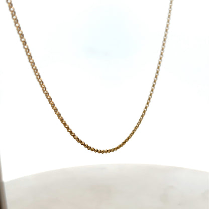 9ct yellow gold belcher chain by Reeves and Sons, 2.8g, showing close-up of chain links and gold shine.