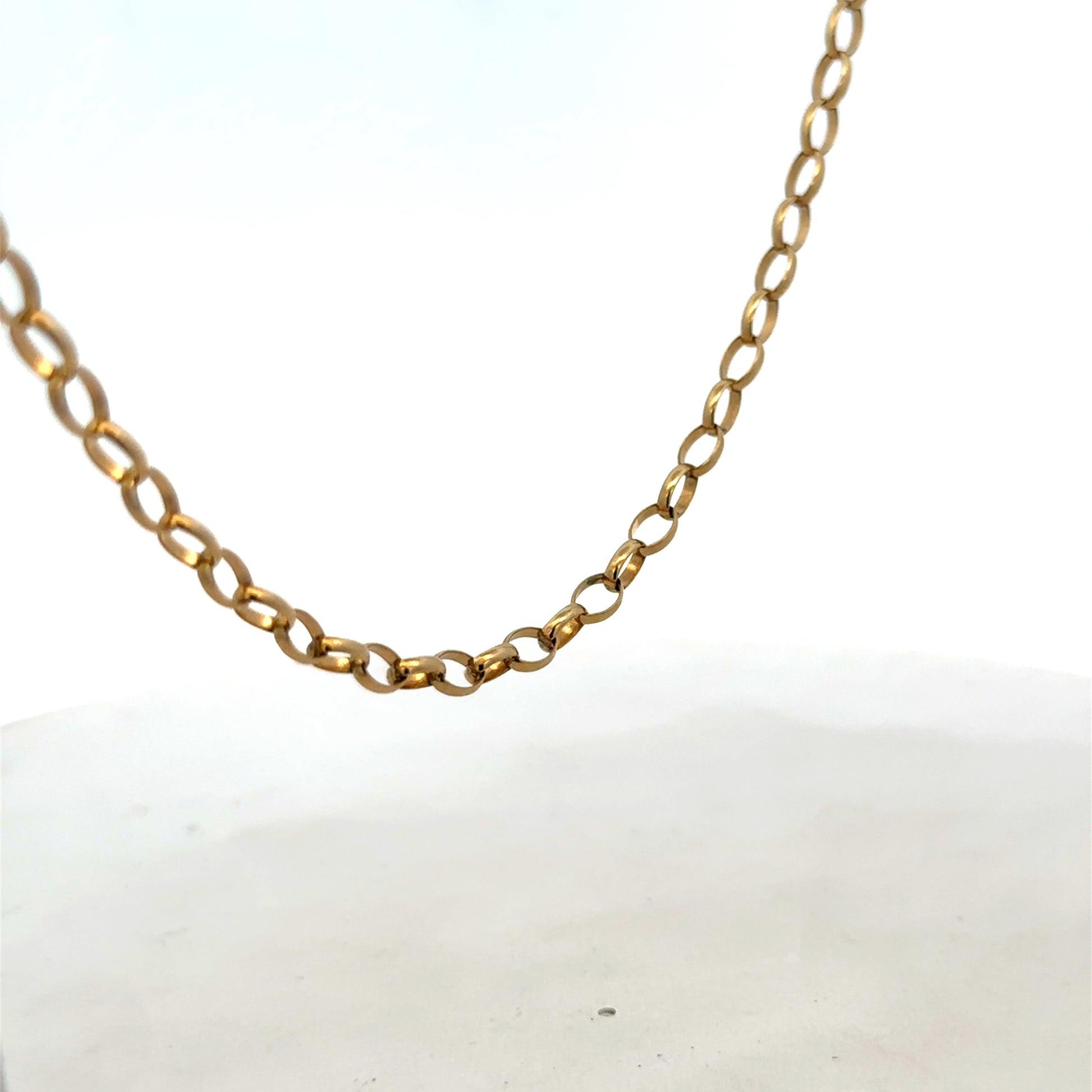 9ct yellow gold belcher chain from Reeves and Sons, showing a close-up of its links and polished finish.