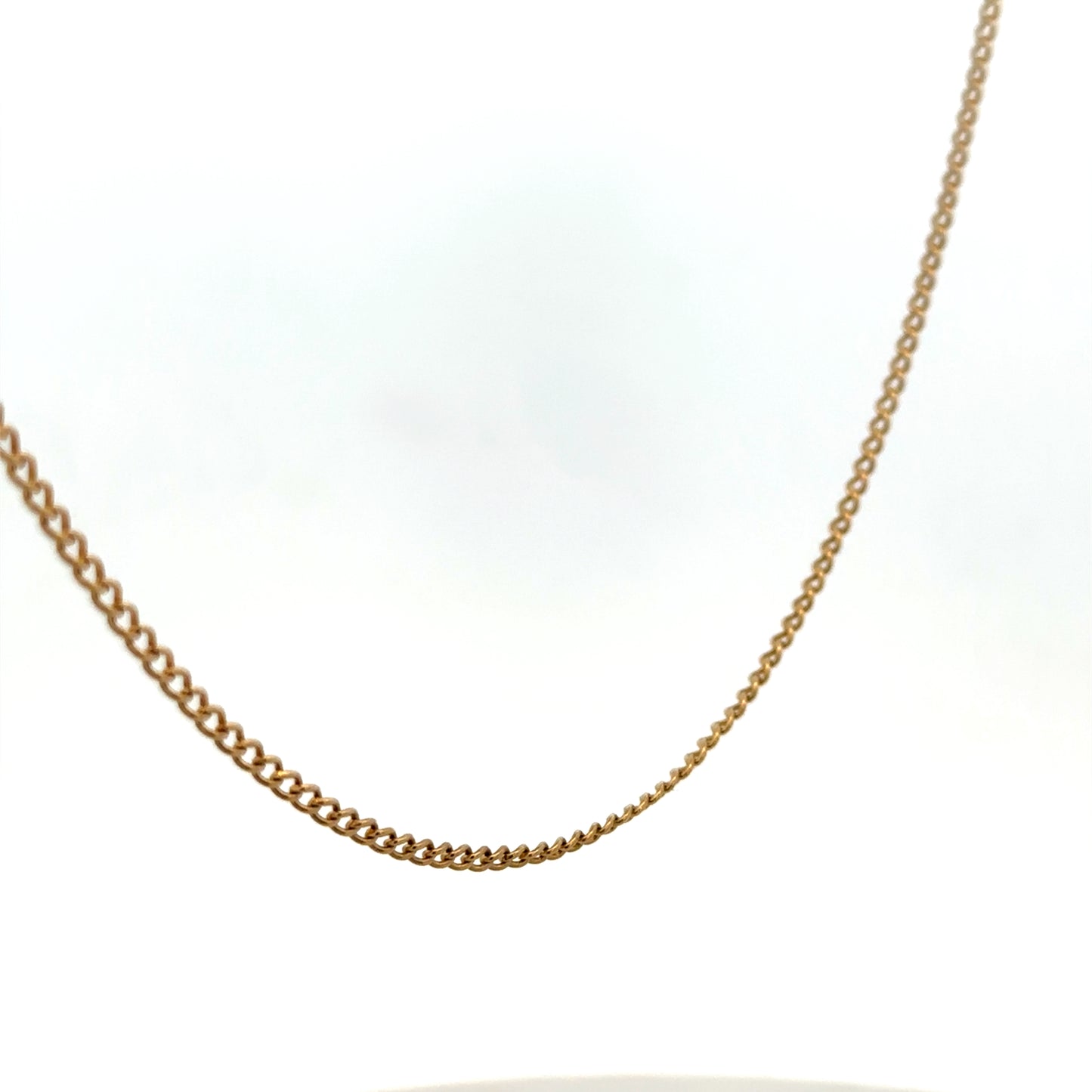 9ct yellow gold chain weighing 4.6g, featuring a delicate link design from Reeves and Sons, displayed on a neutral background.