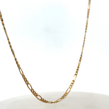 9ct yellow gold figaro chain from Reeves and Sons, showcasing its linked chain design and polished finish.