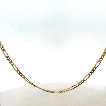 Reeves and Sons 9ct yellow gold figaro chain with a 7.1g weight, featuring interlinked flat and oval links.