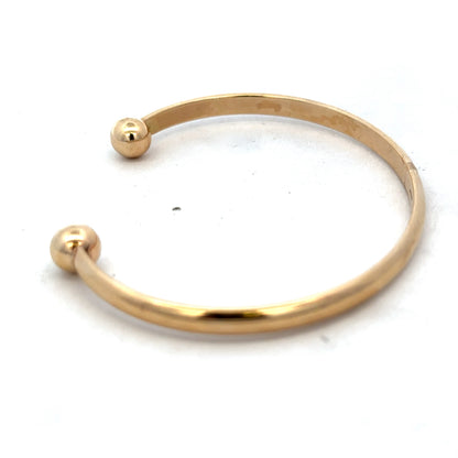 9ct yellow gold bracelet bangle weighing 16.1g, Reeves and Sons, featuring a smooth polished finish and elegant design.
