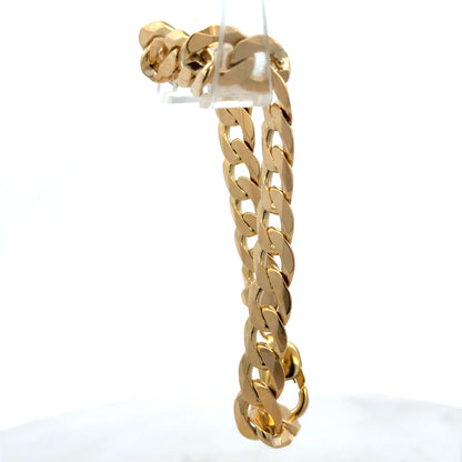9ct yellow gold curb bracelet with intricate links, weighing 29.9g, from Reeves and Sons, displayed on a neutral background.