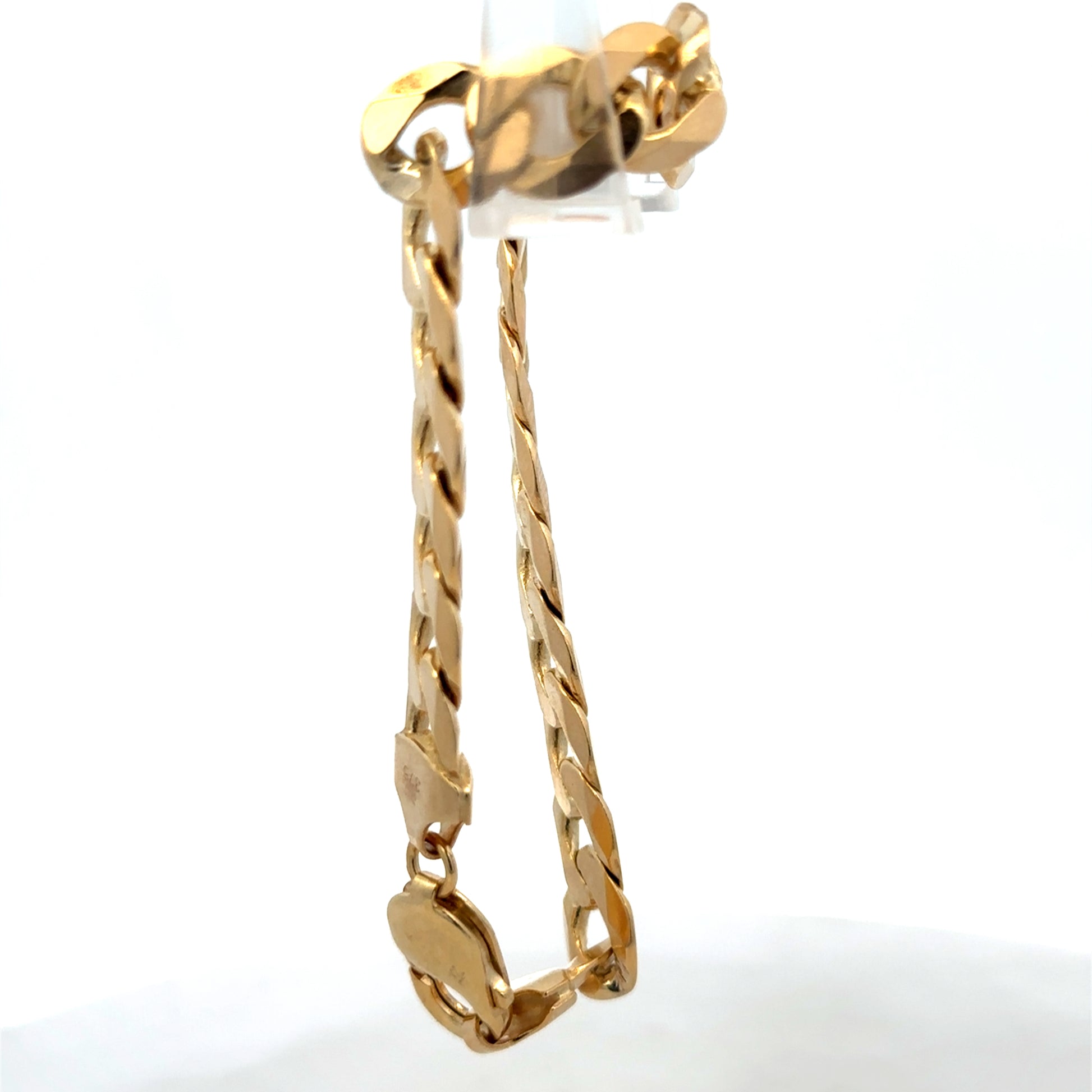 9ct yellow gold curb bracelet weighing 29.9g with intricate link design, crafted by Reeves and Sons.