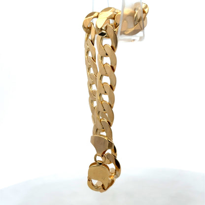9ct yellow gold curb bracelet weighing 29.9g with linked chain design, by Reeves and Sons, shown in close-up.