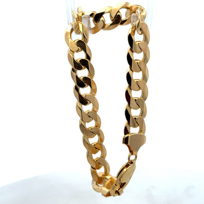 9ct yellow gold curb bracelet weighing 29.9g with a polished finish, featuring interlinked flat oval links from Reeves and Sons.