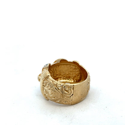 9ct yellow gold buckle ring in size Y by Reeves and Sons, showcasing a polished gold band with a buckle design.
