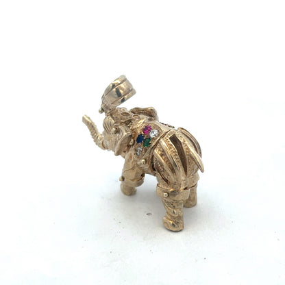 9ct yellow gold elephant pendant from Reeves and Sons, weighs 25.3g, with detailed elephant design, shown in close-up image.