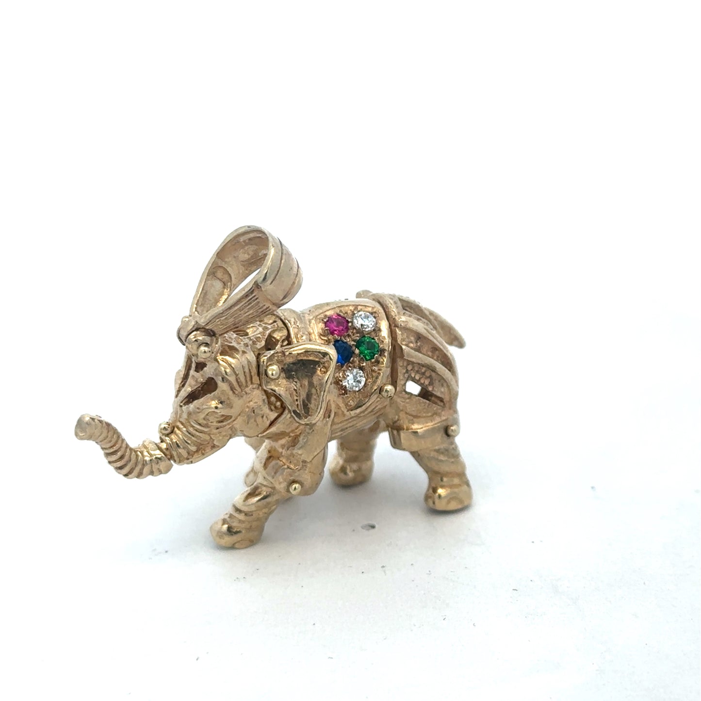 9ct yellow gold elephant pendant with detailed design, weighing 25.3g, crafted by Reeves and Sons.