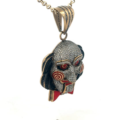 9ct yellow gold jigsaw pendant from Reeves and Sons, showcasing a detailed puzzle piece design with polished finish.