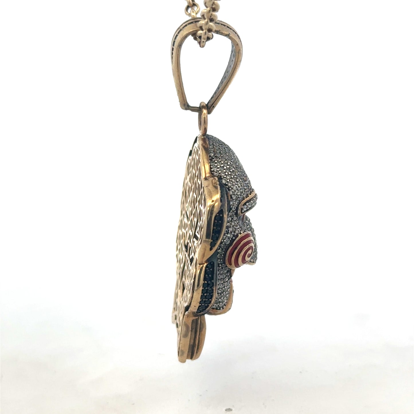 9ct yellow gold jigsaw pendant with Reeves and Sons branding, featuring intricate puzzle piece design and polished finish.